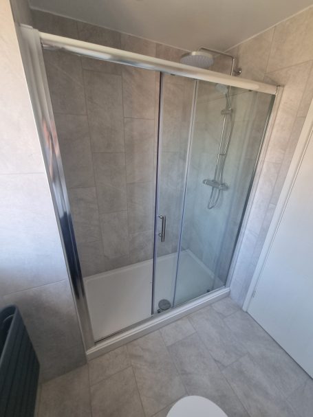 new modern mira shower by bathrooms kitchens and gardens ïBathroom renovation ïModern shower alcove ïManhattan grey tiles Bathroom
